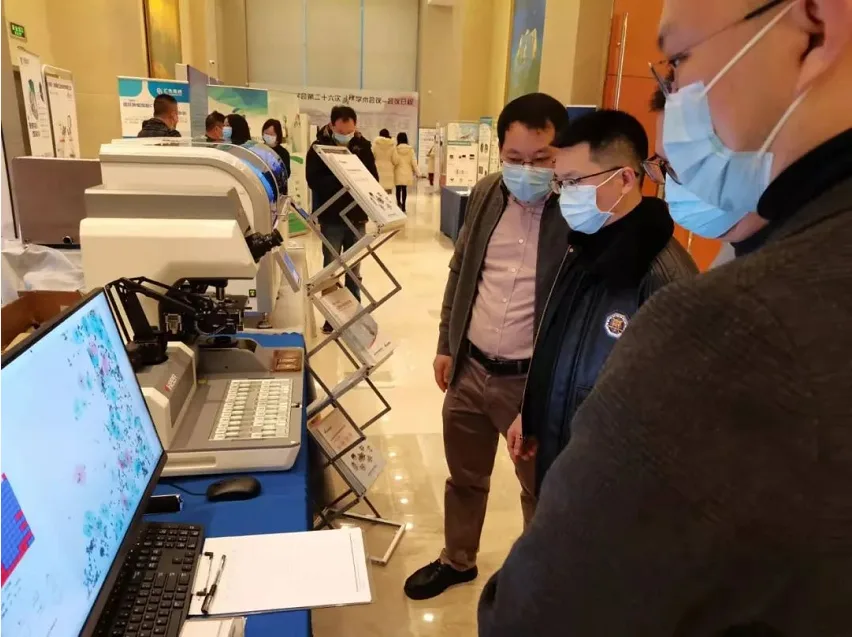 Staff demonstrate equipment operation for experts